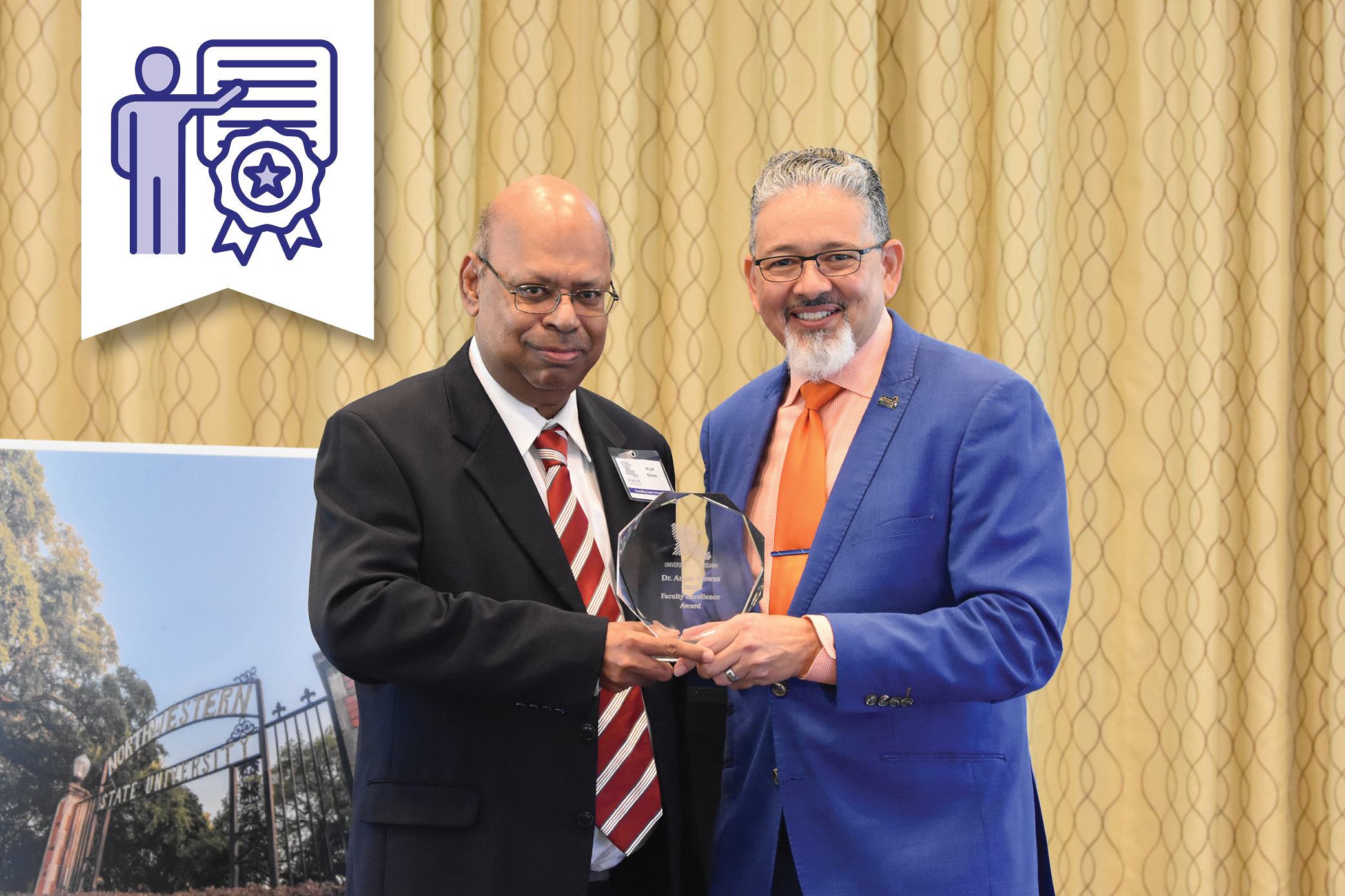 Dr. Rick Gallot presenting the Faculty Excellence award to Dr. Anjan Biswas, Grambling State University.
