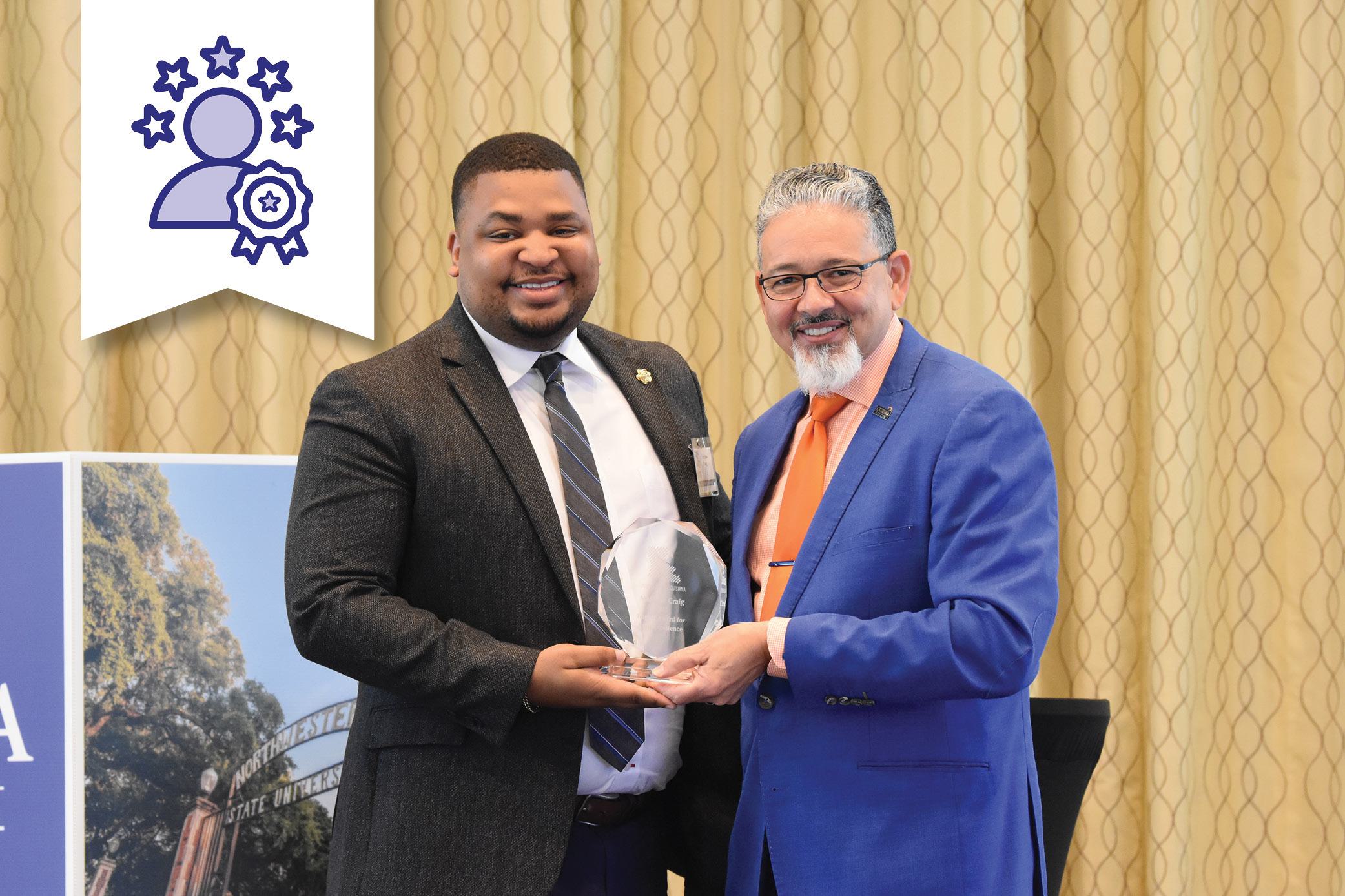 Dr. Rick Gallot presenting the Staff Excellence award to Matthew Craig, Northwestern State University.